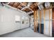 Unfinished basement featuring door and window, and exposed ductwork and beams at 2038 Cresthaven Walk, Woodstock, GA 30189