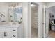 Bathroom featuring modern vanity with drawers and view of closet with wire shelving at 2038 Cresthaven Walk, Woodstock, GA 30189