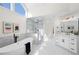 Modern bathroom with a soaking tub and glass shower boasts stylish fixtures and ample light at 2038 Cresthaven Walk, Woodstock, GA 30189