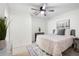 Cozy bedroom showcasing patterned bedding, area rug, and ample natural light at 2038 Cresthaven Walk, Woodstock, GA 30189