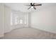 Spacious bedroom features neutral carpet, ceiling fan, and a charming bay window at 2038 Cresthaven Walk, Woodstock, GA 30189