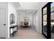 Bright dining room with hardwood floors, modern lighting, and beautiful views at 2038 Cresthaven Walk, Woodstock, GA 30189