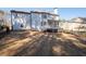 Exterior view of home, with a walk out deck, stairs to grade, and large lawn at 2038 Cresthaven Walk, Woodstock, GA 30189