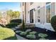 Charming stone steps lead up to the front door with professionally landscaped yard at 2038 Cresthaven Walk, Woodstock, GA 30189