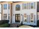 Elegant home entrance featuring stone steps and detailed trim at 2038 Cresthaven Walk, Woodstock, GA 30189