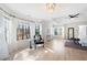 Bright main bedroom with hardwood floors, ceiling fan, and large windows with sheer curtains at 2038 Cresthaven Walk, Woodstock, GA 30189