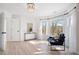 Bright main bedroom featuring hardwood floors, large windows, and modern decor at 2038 Cresthaven Walk, Woodstock, GA 30189