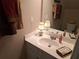 Bathroom featuring a white vanity, sink, mirror, and warm lighting from a small lamp at 215 Kigian Trl, Woodstock, GA 30188