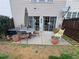 Cozy patio with an umbrella table, chairs, and sliding glass doors, ideal for outdoor enjoyment and easy indoor access at 215 Kigian Trl, Woodstock, GA 30188