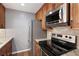 Close up view of a kitchen with stainless steel appliances and granite countertops at 25309 Plantation Ne Dr # 309, Atlanta, GA 30324