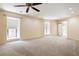 Spacious living room with natural light from windows and French doors with neutral color palette at 25309 Plantation Ne Dr # 309, Atlanta, GA 30324