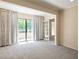 Bright living room with sliding doors leading to a balcony at 25309 Plantation Ne Dr # 309, Atlanta, GA 30324