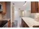 Open-concept layout showcases the modern kitchenette, with granite countertops and a spacious adjacent living area at 25309 Plantation Ne Dr # 309, Atlanta, GA 30324