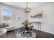 Cozy dining area with a modern round table, stools, and a decorative pendant light fixture at 2978 Edgemont Ln, Marietta, GA 30008