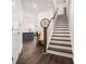 Inviting entryway with hardwood floors, a staircase, and modern decor leading into the home at 2978 Edgemont Ln, Marietta, GA 30008