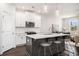 Bright, open kitchen with an island, pendant lighting, and a view into the living area at 2978 Edgemont Ln, Marietta, GA 30008