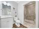 Elegant bathroom featuring a glass-enclosed shower, white cabinets, and a marble countertop at 9795 Terrace Lake Pointe, Roswell, GA 30076