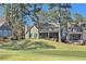 View of the home's rear exterior from the golf course at 9795 Terrace Lake Pointe, Roswell, GA 30076