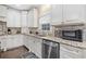 Kitchen with ample cabinet space, granite countertops and stainless steel appliances at 9795 Terrace Lake Pointe, Roswell, GA 30076