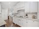 A modern kitchen showcases granite countertops and clean white cabinetry at 9795 Terrace Lake Pointe, Roswell, GA 30076