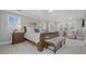 Spacious main bedroom featuring a sitting area, soft lighting, and ensuite bathroom at 9795 Terrace Lake Pointe, Roswell, GA 30076