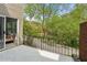 Relaxing balcony view with black metal railing and lush trees at 5273 Glenridge Dr # 5273, Sandy Springs, GA 30342