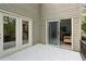 Private balcony with tile flooring and access to both a sunroom and a covered porch at 5273 Glenridge Dr # 5273, Sandy Springs, GA 30342