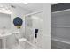 A modern bathroom with a sleek glass enclosed shower and custom storage at 5273 Glenridge Dr # 5273, Sandy Springs, GA 30342