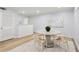Dining area with bright and neutral tones, laminate wood flooring and modern art at 5273 Glenridge Dr # 5273, Sandy Springs, GA 30342