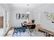 Dining room with light walls, modern art, and patio door to brick-paved outdoor area at 5273 Glenridge Dr # 5273, Sandy Springs, GA 30342