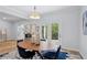 Elegant dining room featuring modern chandelier, french doors, and new hardwood floor at 5273 Glenridge Dr # 5273, Sandy Springs, GA 30342