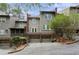 A beautiful townhome with well-maintained landscaping and an attached two-car garage at 5273 Glenridge Dr # 5273, Sandy Springs, GA 30342