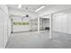 A spacious garage with white walls, built-in storage cabinets, and a durable concrete floor at 5273 Glenridge Dr # 5273, Sandy Springs, GA 30342