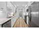 Modern kitchen with stainless steel appliances, white cabinets, and open layout at 5273 Glenridge Dr # 5273, Sandy Springs, GA 30342