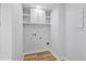 Laundry room features overhead cabinets, wood look flooring, and hookups at 5273 Glenridge Dr # 5273, Sandy Springs, GA 30342