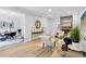 Bright living room with fireplace, wooden floors, and adjacent dining area at 5273 Glenridge Dr # 5273, Sandy Springs, GA 30342