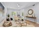Bright living room featuring white couch, fireplace and glass doors to the backyard at 5273 Glenridge Dr # 5273, Sandy Springs, GA 30342