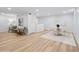 Open floor plan with laminate wood flooring, and a dining table next to seating at 5273 Glenridge Dr # 5273, Sandy Springs, GA 30342