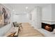 A comfortable living room featuring modern decor, a fireplace, and wood floors at 5273 Glenridge Dr # 5273, Sandy Springs, GA 30342