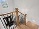 Staircase with wooden railings and banisters, black iron spindles, and hardwood steps at 5273 Glenridge Dr # 5273, Sandy Springs, GA 30342