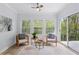 Cozy sunroom with neutral decor, large windows, and lots of natural light at 5273 Glenridge Dr # 5273, Sandy Springs, GA 30342
