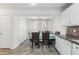 Inviting dining area with a traditional table, seating for six, and a view of the backyard at 7282 Williamsburg Dr, Riverdale, GA 30274