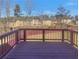 Wooden deck offering a tranquil outdoor space with views of the surrounding backyard and neighborhood at 8120 Berrywood Ct, Covington, GA 30014