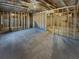 Unfinished basement with wooden framing and concrete floor, ready for customization at 8120 Berrywood Ct, Covington, GA 30014