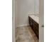 Bathroom featuring double sink vanity with tile flooring at 8120 Berrywood Ct, Covington, GA 30014