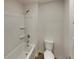 Bathroom featuring tub, toilet, and shower head at 8120 Berrywood Ct, Covington, GA 30014