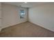 Cozy bedroom with neutral carpet and natural light from a window at 8120 Berrywood Ct, Covington, GA 30014