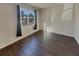 Bright bedroom featuring vinyl floors, large windows offering views of the neighborhood, and ample natural light at 8120 Berrywood Ct, Covington, GA 30014