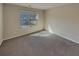 This bedroom features neutral walls, a window, and carpet at 8120 Berrywood Ct, Covington, GA 30014