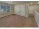 Second floor bonus room featuring neutral carpet, window, and an interior hallway at 8120 Berrywood Ct, Covington, GA 30014